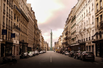 City street amidst buildings against sky