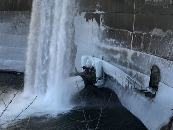 Water splashing against wall