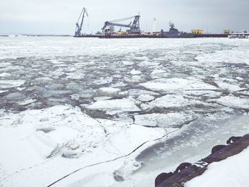 Scenic view of frozen sea against sky