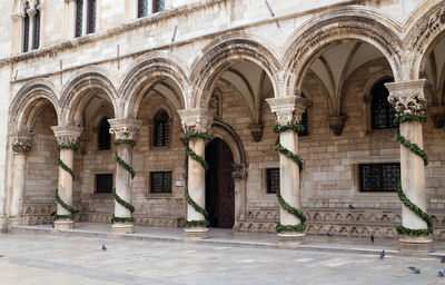 Columns and exterior of the duke's palace decorated with advent wreaths in dubrovnik, croatia