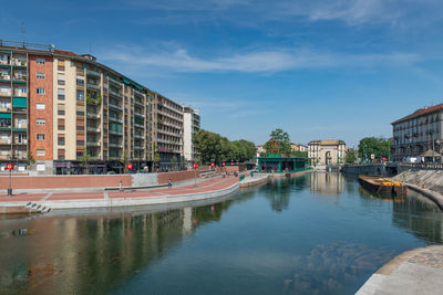 Canal amidst buildings in city