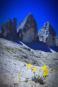 Scenic view of rocky mountains against clear blue sky