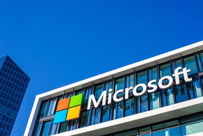 Low angle view of building against clear blue sky