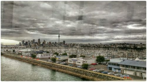 Cityscape against cloudy sky