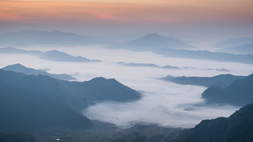 Scenic view of mountain against cloudy sky