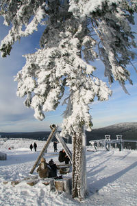 People enjoying at snow field