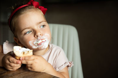 Close-up of girl eating food