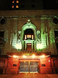 Low angle view of illuminated building at night