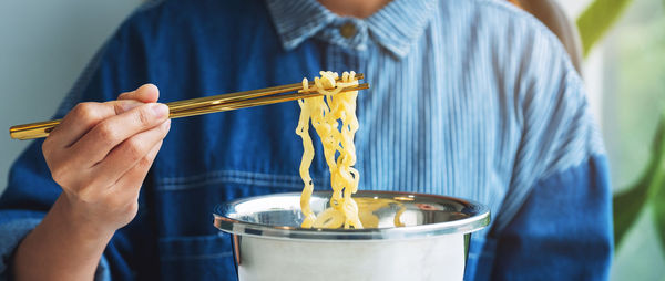 Midsection of man preparing food