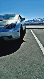 Car on road against mountain range