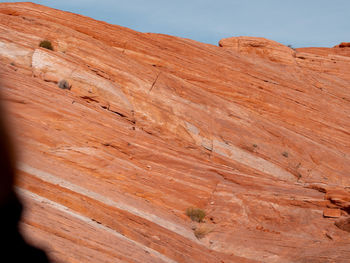 Low angle view of rock formations against sky