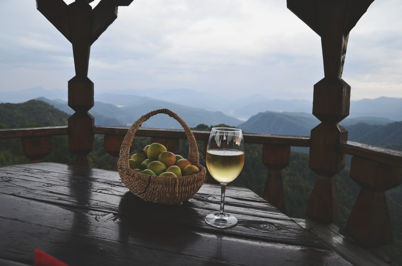 food and drink, table, mountain, nature, water, food, freshness, fruit, healthy eating, cloud - sky, sky, refreshment, no people, drink, mountain range, beauty in nature, glass, day, wineglass, outdoors
