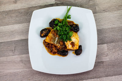 High angle view of fish served in plate on table