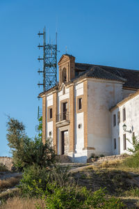 Low angle view of old building against clear sky