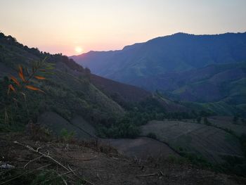 Scenic view of mountains against sky during sunset