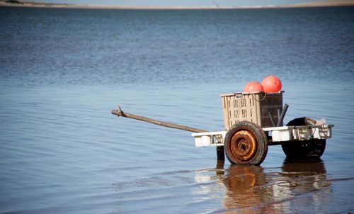 Man in sea against sky