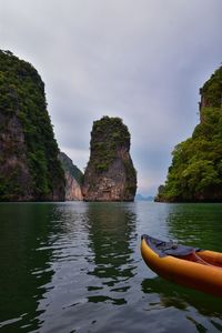 Boat floating in sea against sky