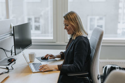 Smiling woman working in office