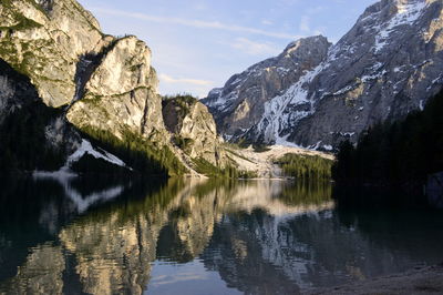 Scenic view of lake and mountains against sky