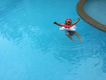 Portrait of boy in swimming pool