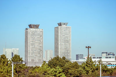 Modern cityscape against clear sky