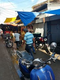 Man riding motorcycle on street in city