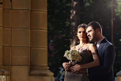 Young couple standing outdoors