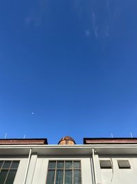 Low angle view of building against blue sky