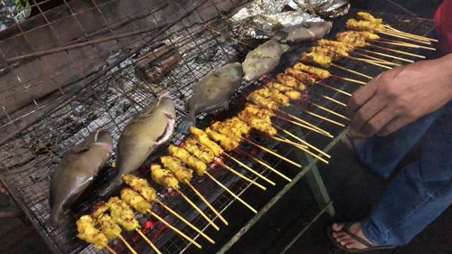 High angle view of meat on barbecue grill