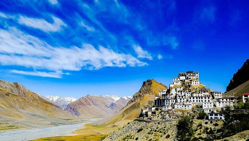 View of mountain range against blue sky