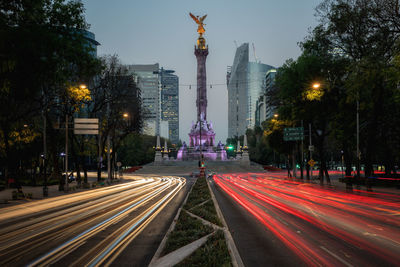 Light trails on road in city at night