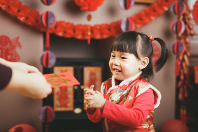 Portrait of cute baby girl in shop