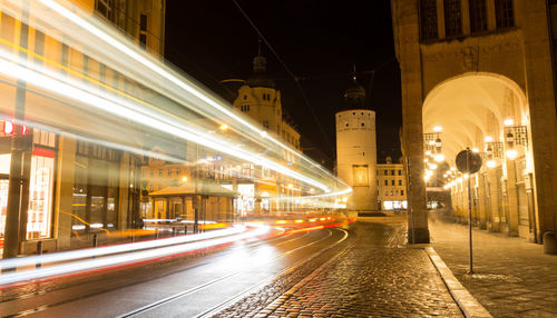 Light trails on illuminated city at night