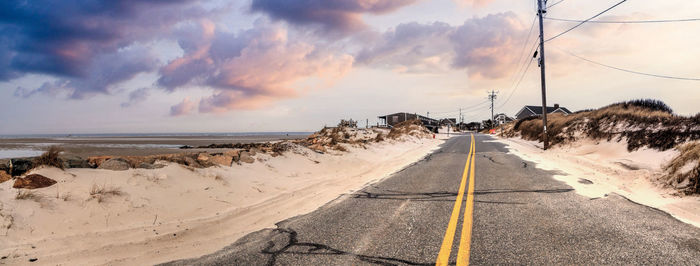 Roadway along chapin beach in cape cod, massachusetts at sunset.