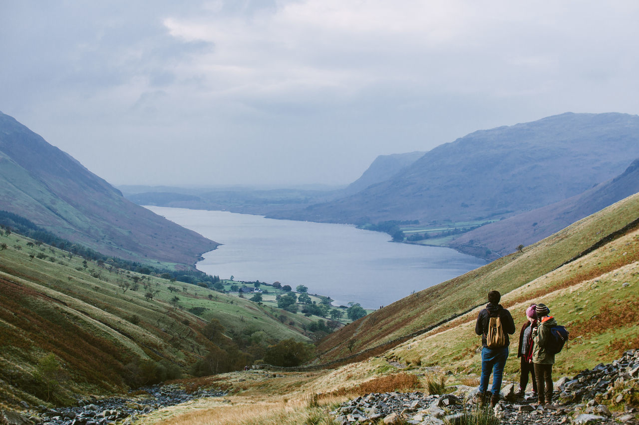 mountain, real people, beauty in nature, nature, scenics, men, two people, sky, mountain range, leisure activity, outdoors, lifestyles, landscape, day, cloud - sky, water, togetherness, people, adult