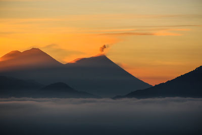 Scenic view of mountains against sky during sunset