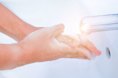 Close-up of hand holding water