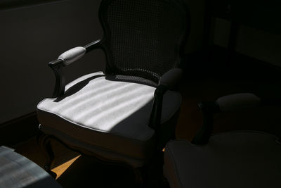 High angle view of chair on bed at home