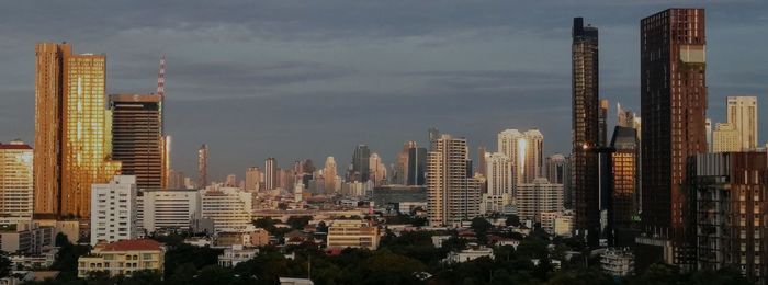 Modern buildings in city against sky