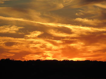 Low angle view of dramatic sky during sunset
