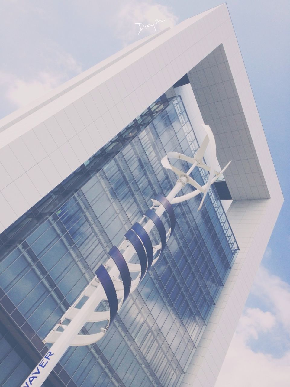 low angle view, architecture, built structure, modern, building exterior, sky, office building, building, city, glass - material, skyscraper, tall - high, sunlight, day, reflection, no people, outdoors, cloud - sky, white color, cloud