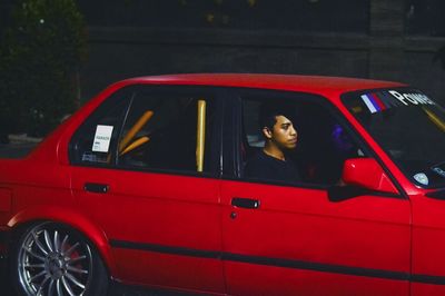 Portrait of woman sitting in car