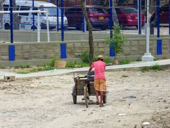 Rear view of man sitting on seat