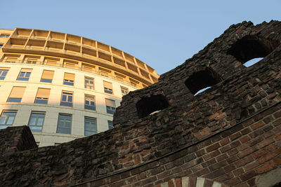 Low angle view of old building against clear sky