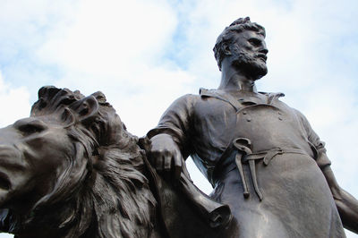 Low angle view of statue against sky