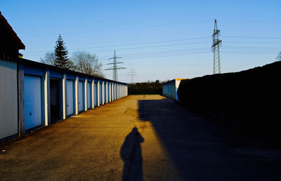Walkway against clear sky
