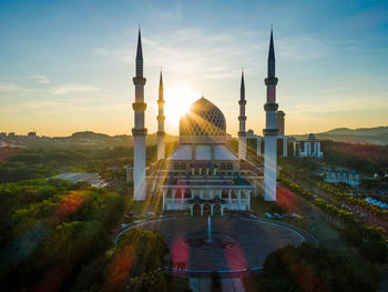 Mosque against sky during sunset