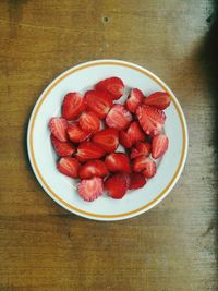 High angle view of strawberries in plate on table