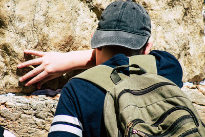 Low section of man on rock