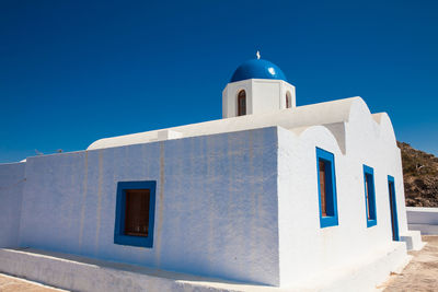 Low angle view of building against clear blue sky